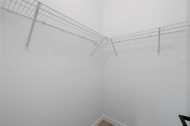 1532 Maricopa Rd, North Port, FL 34287 - walk in closet featuring wood finished floors