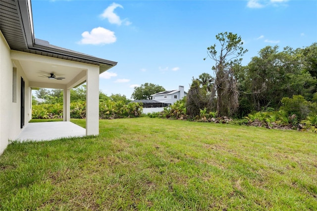 1532 Maricopa Rd, North Port, FL 34287 - view of grassy yard featuring a ceiling fan and a patio area