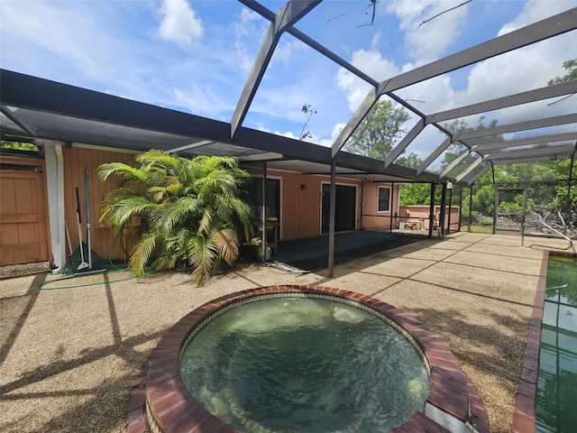 6305 Bikini Rd, Sarasota, FL 34241 - swimming pool featuring a patio and glass enclosure