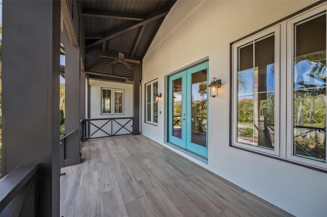 5569 Cape Leyte Dr, Sarasota, FL 34242 - wooden terrace with ceiling fan and french doors