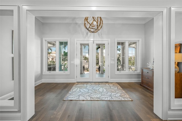 5569 Cape Leyte Dr, Sarasota, FL 34242 - foyer featuring healthy amount of natural light, wood finished floors, french doors, and crown molding