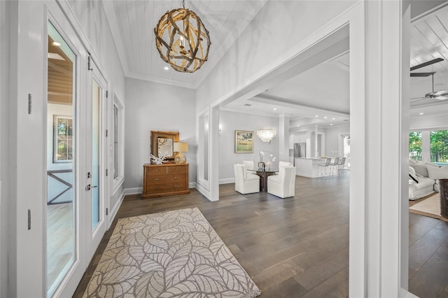 5569 Cape Leyte Dr, Sarasota, FL 34242 - foyer featuring a chandelier, french doors, crown molding, dark wood-style flooring, and recessed lighting