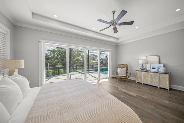5569 Cape Leyte Dr, Sarasota, FL 34242 - bedroom featuring access to outside, a tray ceiling, wood finished floors, recessed lighting, and ceiling fan