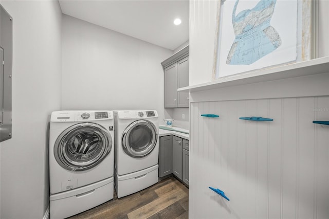 5569 Cape Leyte Dr, Sarasota, FL 34242 - laundry room with cabinet space, dark wood finished floors, separate washer and dryer, and recessed lighting