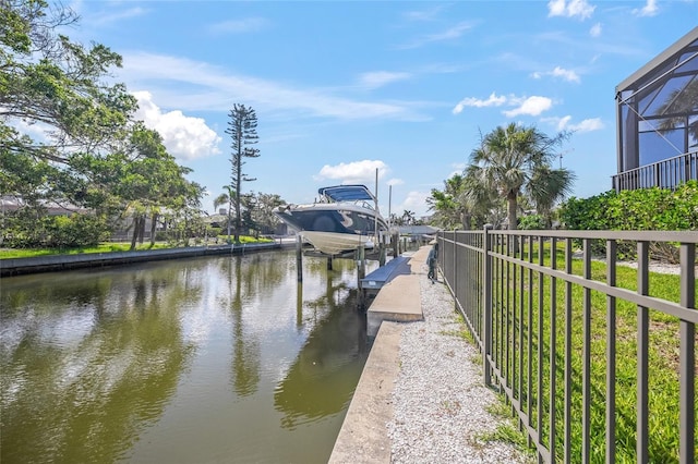 5569 Cape Leyte Dr, Sarasota, FL 34242 - dock area featuring boat lift, a water view, and glass enclosure