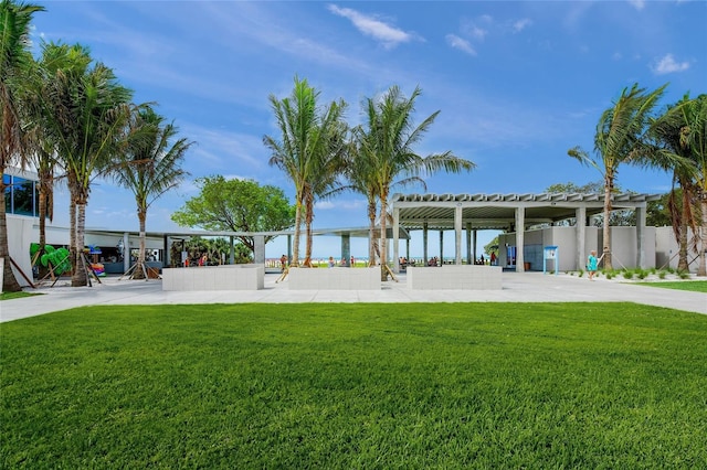 5569 Cape Leyte Dr, Sarasota, FL 34242 - surrounding community with a yard and a pergola