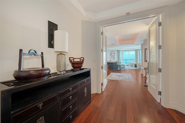 990 Blvd Of The Arts Unit 801, Sarasota, FL 34236 - hall with a raised ceiling and dark wood-type flooring