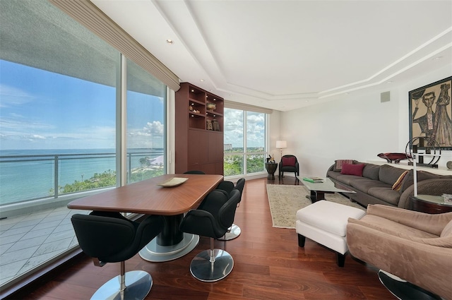 990 Blvd Of The Arts Unit 801, Sarasota, FL 34236 - living area with wood finished floors, a raised ceiling, and a water view