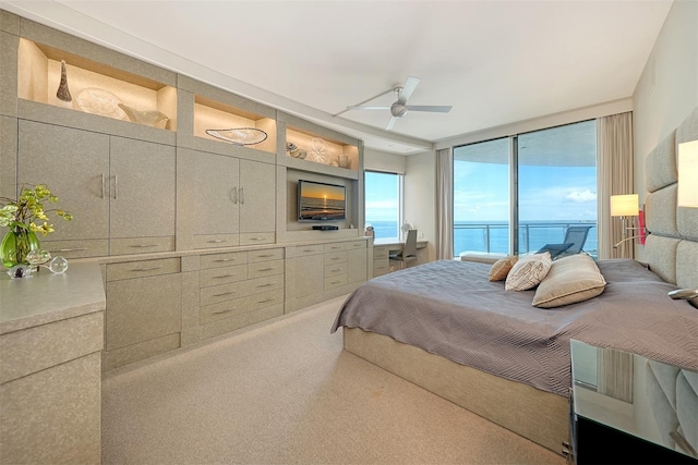 990 Blvd Of The Arts Unit 801, Sarasota, FL 34236 - bedroom featuring access to exterior, carpet flooring, and a ceiling fan