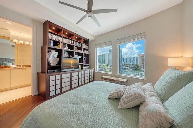 990 Blvd Of The Arts Unit 801, Sarasota, FL 34236 - bedroom with wood finished floors, connected bathroom, and a ceiling fan