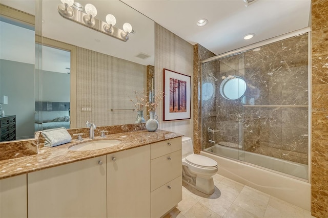 990 Blvd Of The Arts Unit 801, Sarasota, FL 34236 - bathroom with shower / bath combination with glass door, vanity, ensuite bathroom, and recessed lighting
