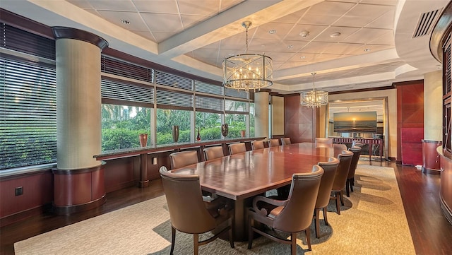 990 Blvd Of The Arts Unit 801, Sarasota, FL 34236 - dining space featuring a chandelier, wood finished floors, and a raised ceiling