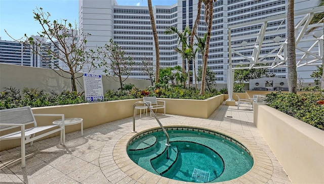990 Blvd Of The Arts Unit 801, Sarasota, FL 34236 - view of swimming pool featuring a community hot tub and a patio area