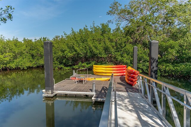 990 Blvd Of The Arts Unit 801, Sarasota, FL 34236 - dock featuring a water view and view of wooded area