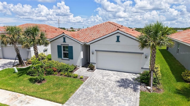 491 Daylily Blvd, Nokomis, FL 34275 - mediterranean / spanish house featuring a garage, a front yard, decorative driveway, and stucco siding