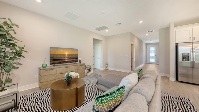 491 Daylily Blvd, Nokomis, FL 34275 - living room with recessed lighting and light wood-type flooring