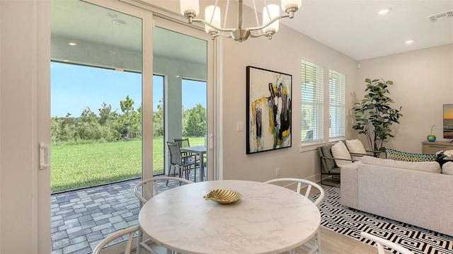 491 Daylily Blvd, Nokomis, FL 34275 - dining room with a chandelier and recessed lighting