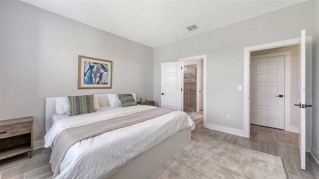 491 Daylily Blvd, Nokomis, FL 34275 - bedroom featuring light wood-style flooring and ensuite bathroom