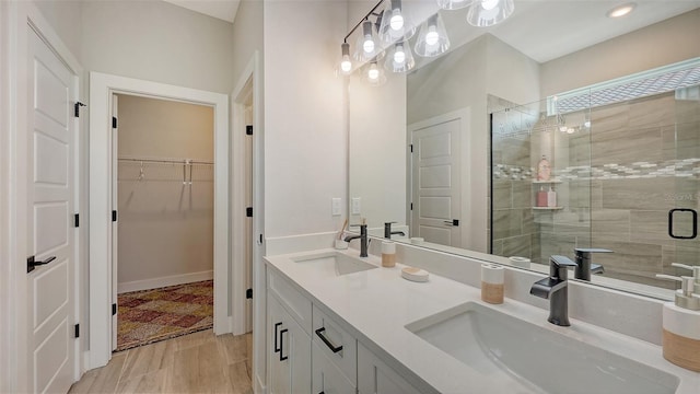 491 Daylily Blvd, Nokomis, FL 34275 - bathroom featuring a stall shower, double vanity, and a spacious closet