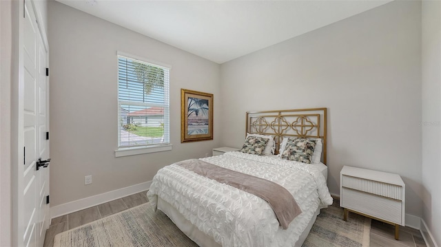 491 Daylily Blvd, Nokomis, FL 34275 - bedroom with multiple windows and wood finished floors