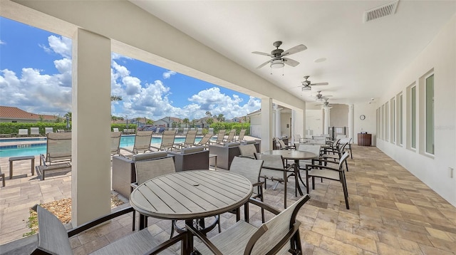 491 Daylily Blvd, Nokomis, FL 34275 - view of patio / terrace featuring ceiling fan, a community pool, and outdoor dining area