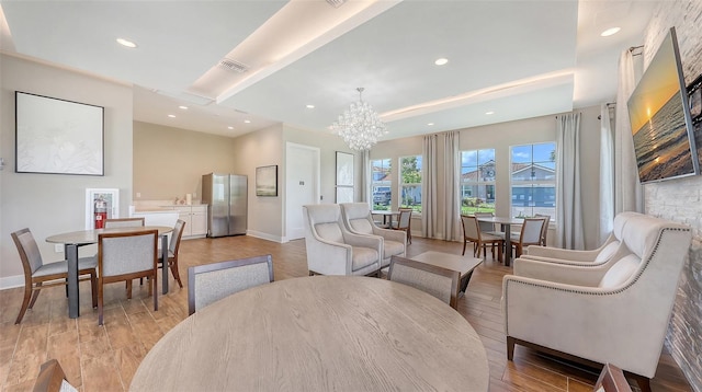 491 Daylily Blvd, Nokomis, FL 34275 - dining area with a chandelier, light wood-style flooring, and recessed lighting