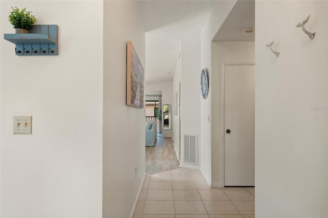 4411 46th Ave W Unit 201, Bradenton, FL 34210 - corridor with light tile patterned flooring and baseboards