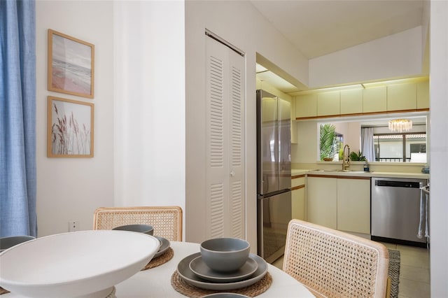 4411 46th Ave W Unit 201, Bradenton, FL 34210 - kitchen with stainless steel appliances, light countertops, and light tile patterned flooring