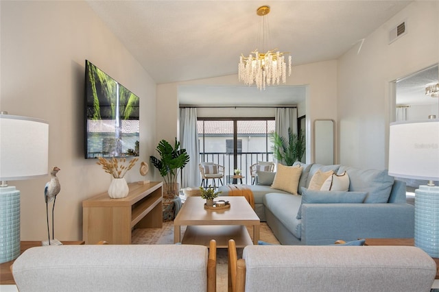 4411 46th Ave W Unit 201, Bradenton, FL 34210 - living area with a chandelier and vaulted ceiling