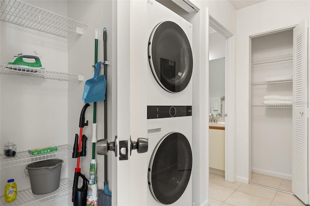 4411 46th Ave W Unit 201, Bradenton, FL 34210 - washroom featuring estacked washer and dryer and tile patterned flooring