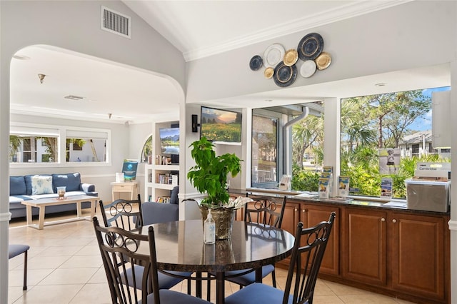 4411 46th Ave W Unit 201, Bradenton, FL 34210 - sunroom / solarium featuring vaulted ceiling, healthy amount of natural light, and arched walkways