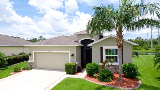 7364 47th Avenue Cir E, Bradenton, FL 34203 - single story home featuring an attached garage, stone siding, stucco siding, and driveway