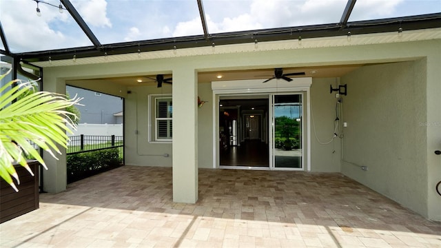 7364 47th Avenue Cir E, Bradenton, FL 34203 - doorway to property with a ceiling fan, stucco siding, and a patio