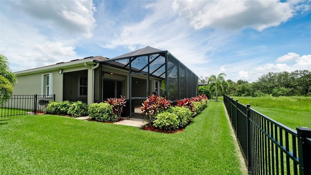 7364 47th Avenue Cir E, Bradenton, FL 34203 - rear view of property with a fenced backyard, a lanai, and stucco siding