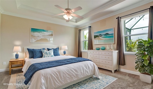 7364 47th Avenue Cir E, Bradenton, FL 34203 - bedroom featuring a raised ceiling, ornamental molding, multiple windows, light colored carpet, and ceiling fan