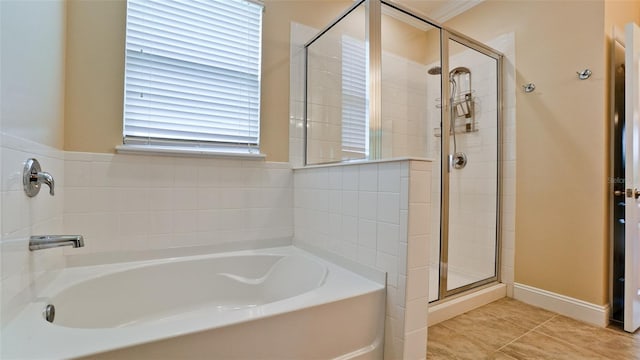 7364 47th Avenue Cir E, Bradenton, FL 34203 - bathroom featuring a bath, a stall shower, and tile patterned floors