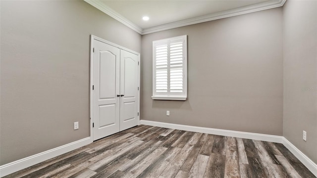 7364 47th Avenue Cir E, Bradenton, FL 34203 - unfurnished bedroom with ornamental molding, wood finished floors, a closet, and recessed lighting