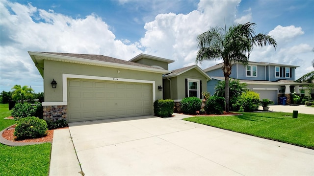 7364 47th Avenue Cir E, Bradenton, FL 34203 - view of front of property with driveway, stucco siding, an attached garage, and a front lawn
