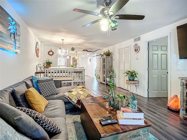3700 S Osprey Ave Unit 122, Sarasota, FL 34239 - living area with wood finished floors, a ceiling fan, and a chandelier