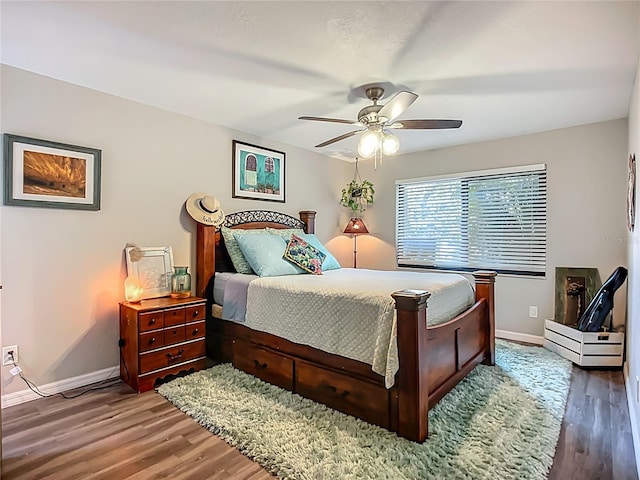 3700 S Osprey Ave Unit 122, Sarasota, FL 34239 - bedroom with wood finished floors and ceiling fan