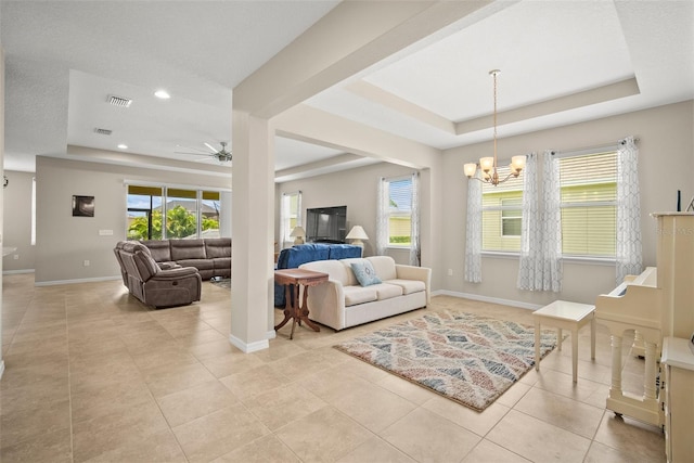 226 Tapa Parish Run, Bradenton, FL 34212 - tiled living room featuring a raised ceiling, a chandelier, ceiling fan, and recessed lighting