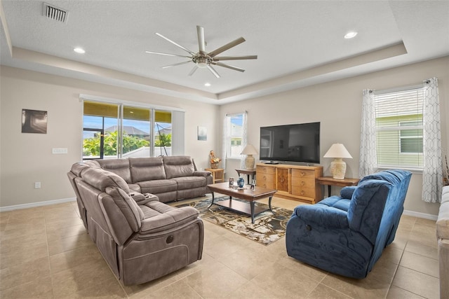226 Tapa Parish Run, Bradenton, FL 34212 - living area with a raised ceiling, a ceiling fan, light tile patterned flooring, and recessed lighting