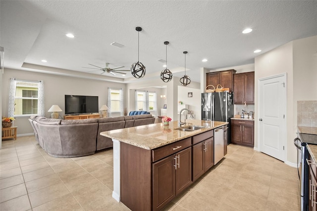 226 Tapa Parish Run, Bradenton, FL 34212 - kitchen featuring stainless steel appliances, ceiling fan, light tile patterned flooring, light stone countertops, and recessed lighting