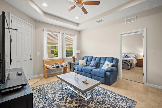 226 Tapa Parish Run, Bradenton, FL 34212 - living room featuring ceiling fan, a raised ceiling, light tile patterned flooring, and recessed lighting