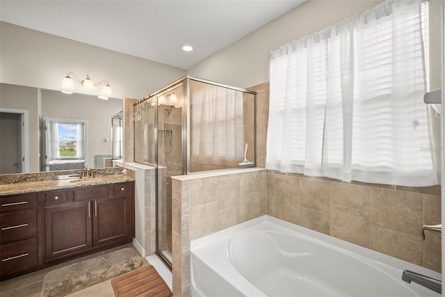 226 Tapa Parish Run, Bradenton, FL 34212 - bathroom with a garden tub, vanity, and a stall shower