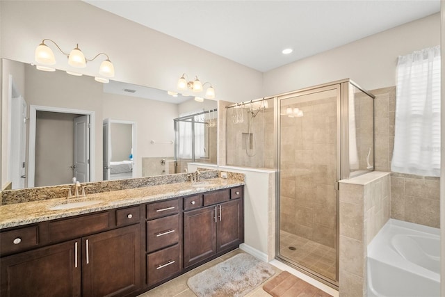 226 Tapa Parish Run, Bradenton, FL 34212 - full bath featuring a garden tub, a stall shower, double vanity, and tile patterned flooring
