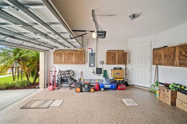 226 Tapa Parish Run, Bradenton, FL 34212 - garage featuring a garage door opener and electric panel