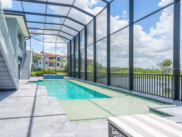 5630 Inspiration Ter, Bradenton, FL 34210 - view of swimming pool featuring a water view, a patio area, and a pool with connected hot tub