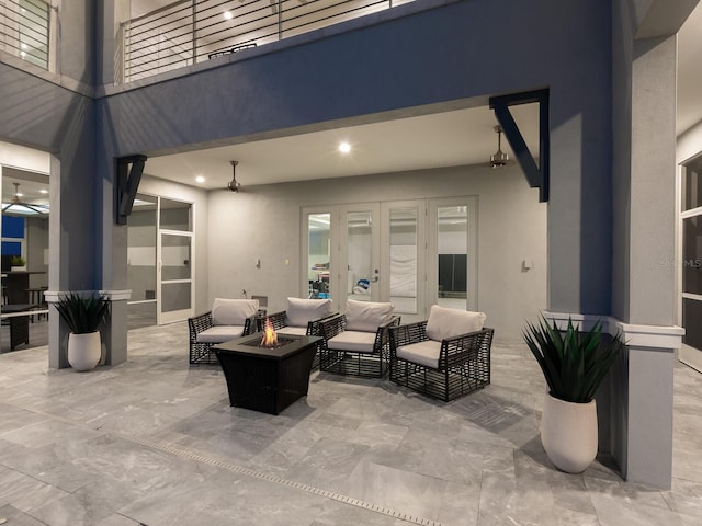 5630 Inspiration Ter, Bradenton, FL 34210 - view of patio / terrace with an outdoor living space with a fire pit and french doors