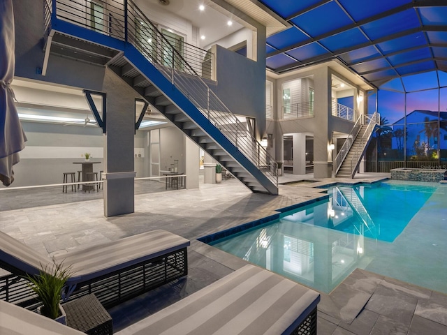 5630 Inspiration Ter, Bradenton, FL 34210 - view of pool with stairs, a pool with connected hot tub, a patio area, and outdoor dining space